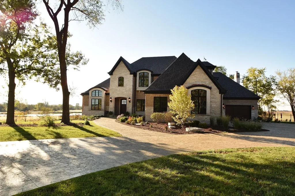 Custom Illinois estate great room with expansive windows and layered neutral interior design.