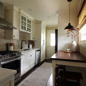 Newly remodeled galley kitchen with lots of storage and integrated washer and dryer